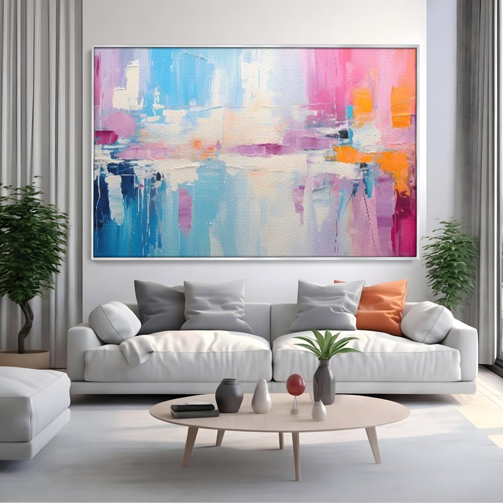 Tablou canvas cu pictura abstracta orizontala in nuante vibrante, in rama de aluminiu argintiu, pe perete intr-un living